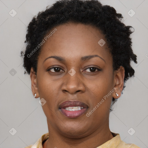 Joyful black adult female with short  brown hair and brown eyes