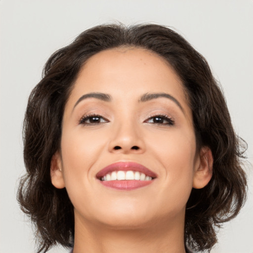 Joyful asian young-adult female with medium  brown hair and brown eyes