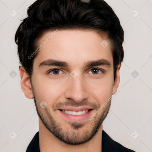 Joyful white young-adult male with short  black hair and brown eyes