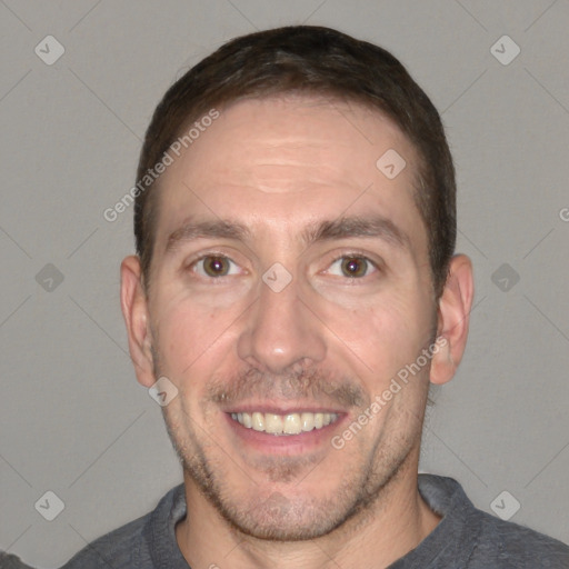 Joyful white adult male with short  brown hair and brown eyes