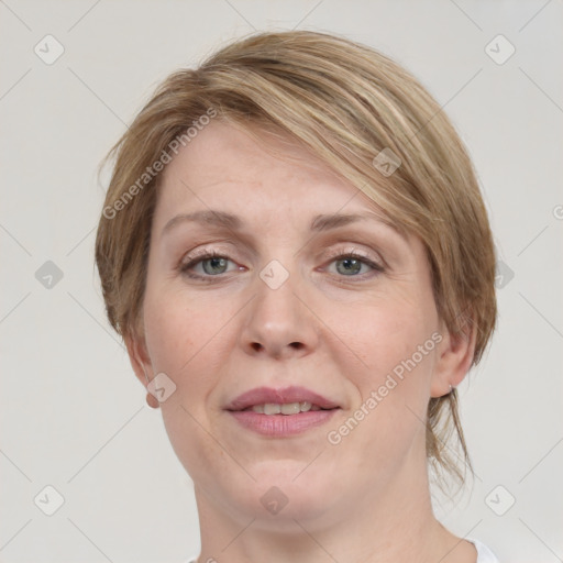 Joyful white adult female with medium  brown hair and grey eyes