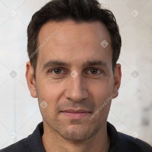 Joyful white adult male with short  brown hair and brown eyes