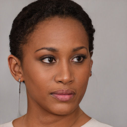 Neutral black young-adult female with short  brown hair and brown eyes
