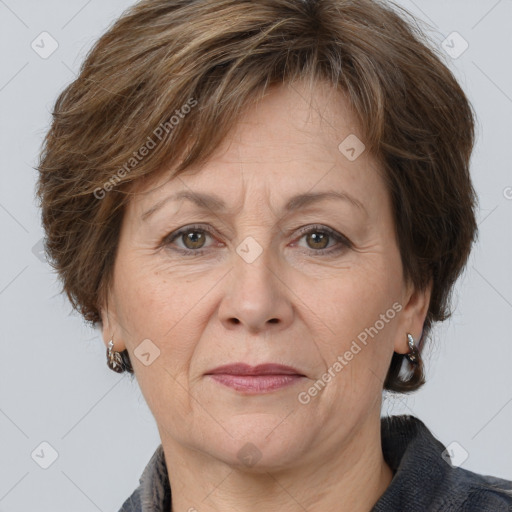 Joyful white adult female with medium  brown hair and grey eyes