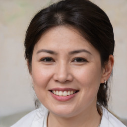 Joyful white adult female with medium  brown hair and brown eyes