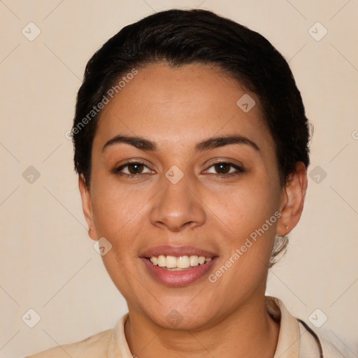 Joyful latino young-adult female with short  black hair and brown eyes