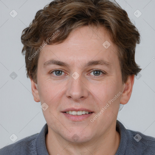 Joyful white adult male with short  brown hair and grey eyes