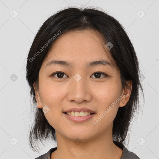 Joyful asian young-adult female with medium  black hair and brown eyes