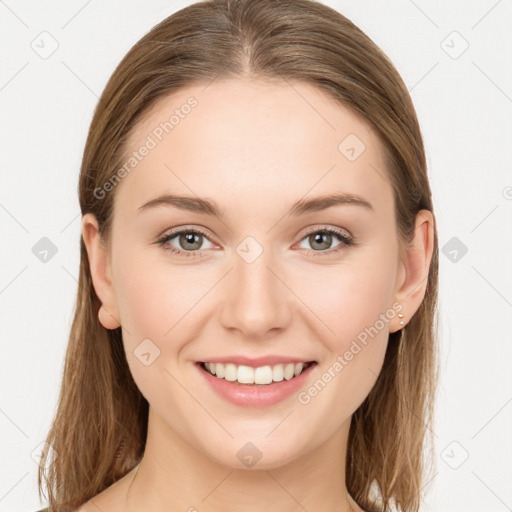 Joyful white young-adult female with long  brown hair and grey eyes