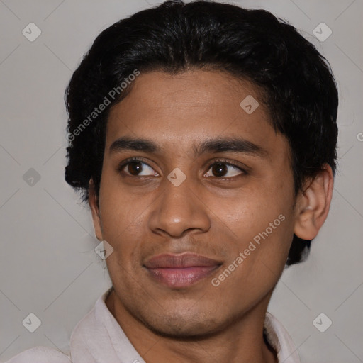 Joyful latino young-adult male with short  black hair and brown eyes