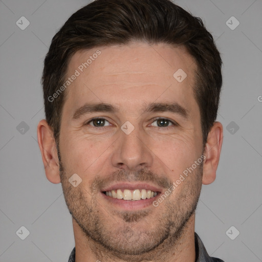 Joyful white adult male with short  brown hair and brown eyes