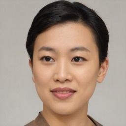 Joyful asian young-adult female with short  black hair and brown eyes