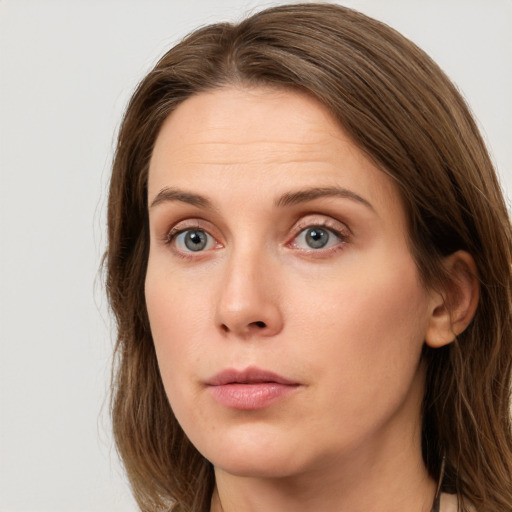 Neutral white young-adult female with long  brown hair and grey eyes