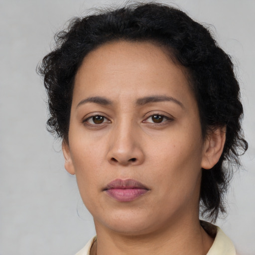 Neutral latino young-adult female with short  brown hair and brown eyes