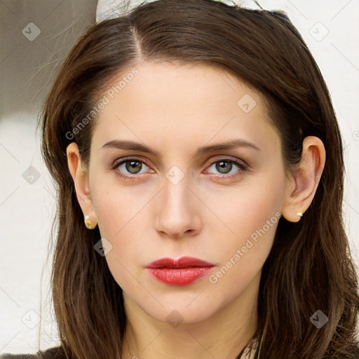 Neutral white young-adult female with long  brown hair and brown eyes