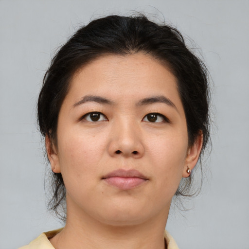 Neutral asian young-adult female with medium  brown hair and brown eyes