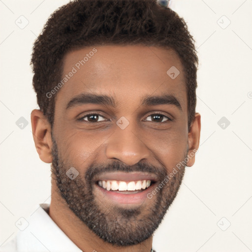 Joyful black young-adult male with short  black hair and brown eyes