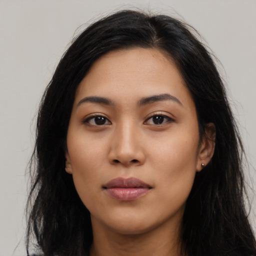 Neutral latino young-adult female with long  black hair and brown eyes