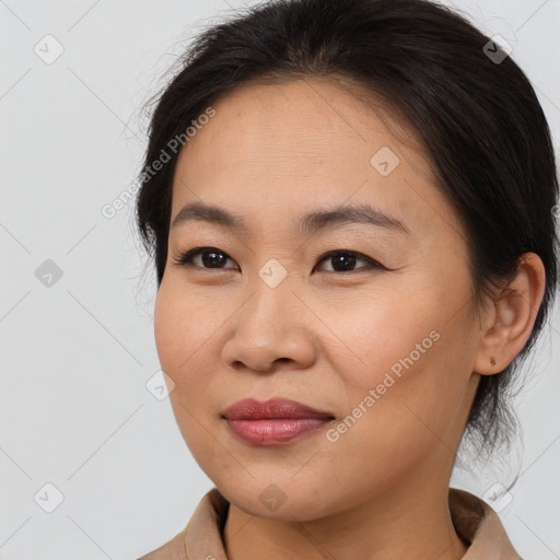 Joyful asian young-adult female with medium  brown hair and brown eyes