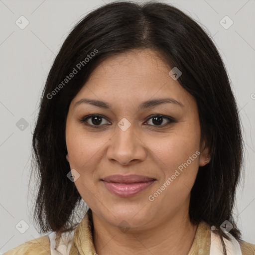 Joyful latino adult female with medium  brown hair and brown eyes