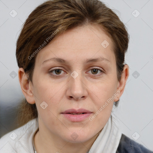 Joyful white adult female with medium  brown hair and grey eyes