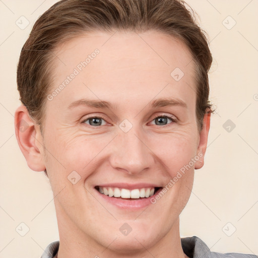 Joyful white young-adult female with short  brown hair and grey eyes