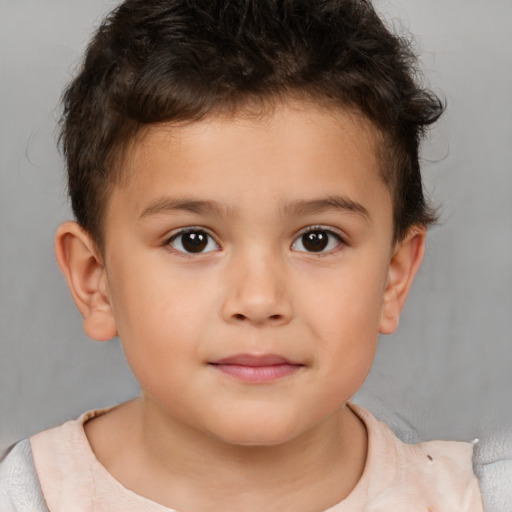 Joyful white child male with short  brown hair and brown eyes