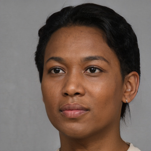 Neutral black young-adult female with short  black hair and brown eyes