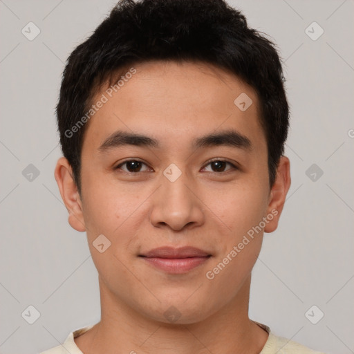 Joyful asian young-adult male with short  brown hair and brown eyes