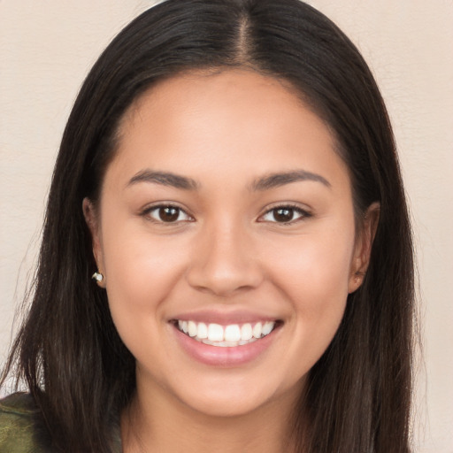 Joyful white young-adult female with long  brown hair and brown eyes