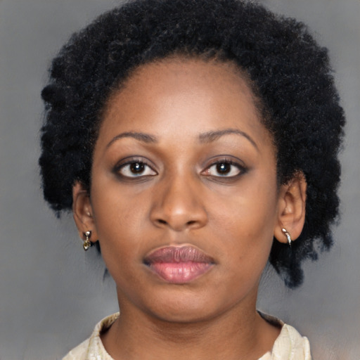 Neutral black young-adult female with medium  black hair and brown eyes