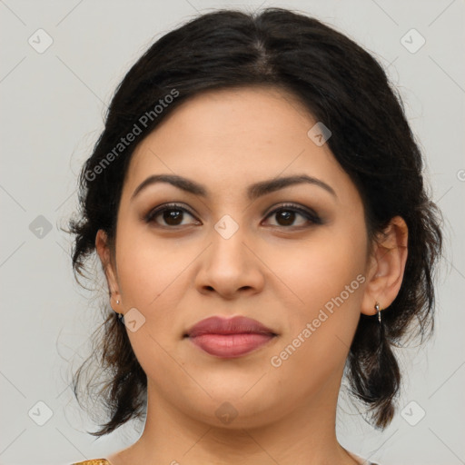 Joyful latino young-adult female with medium  brown hair and brown eyes