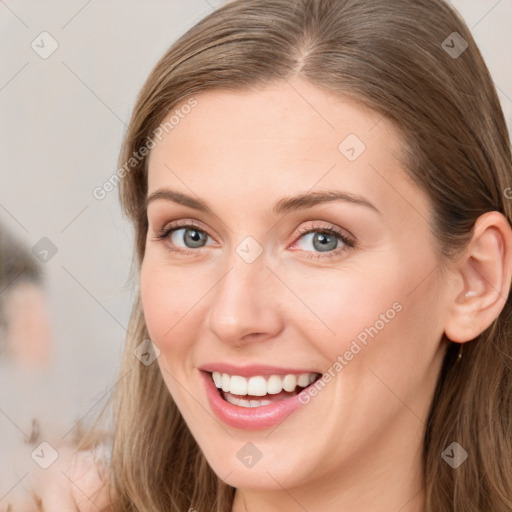 Joyful white young-adult female with long  brown hair and grey eyes