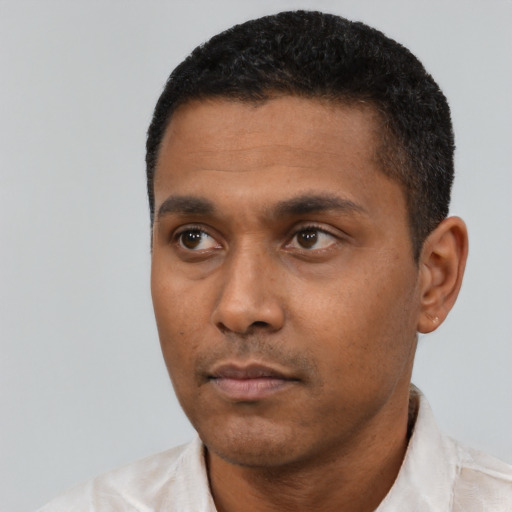 Neutral latino young-adult male with short  black hair and brown eyes