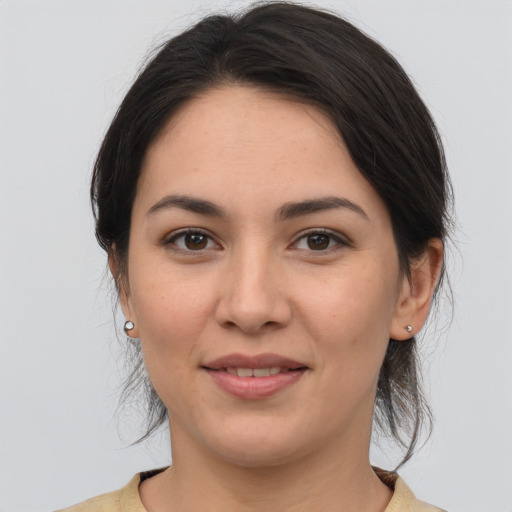 Joyful white young-adult female with medium  brown hair and brown eyes