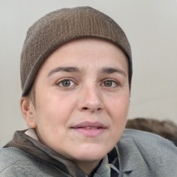 Neutral white young-adult female with short  brown hair and grey eyes