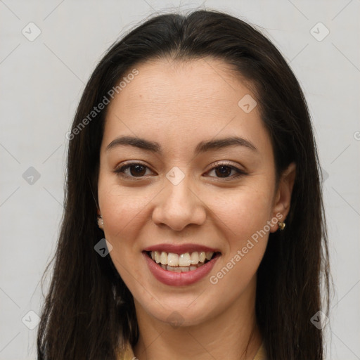 Joyful latino young-adult female with long  brown hair and brown eyes