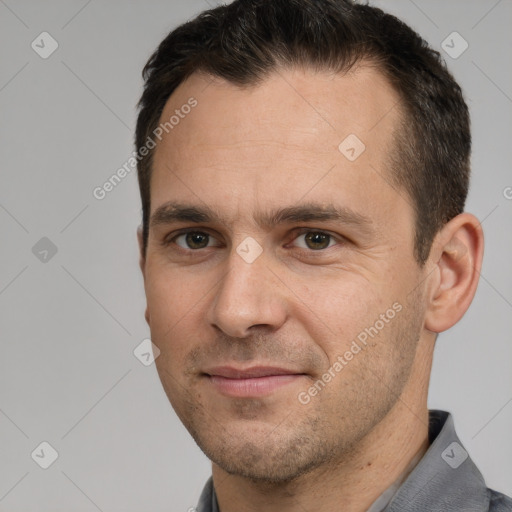 Joyful white adult male with short  brown hair and brown eyes