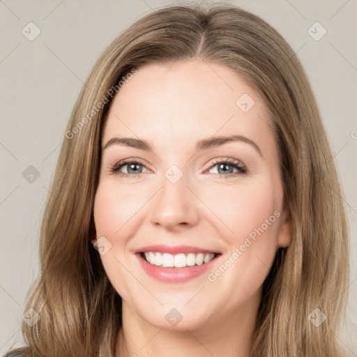 Joyful white young-adult female with long  brown hair and green eyes