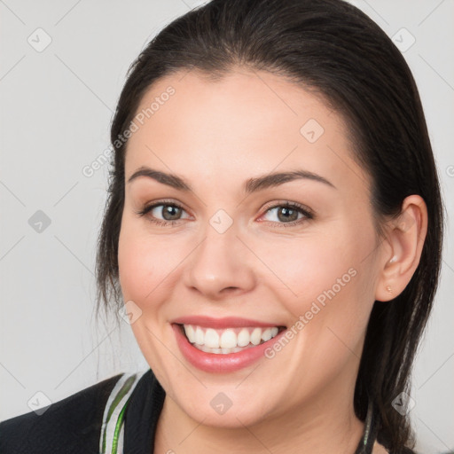 Joyful white young-adult female with medium  brown hair and brown eyes