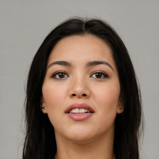 Joyful asian young-adult female with long  black hair and brown eyes