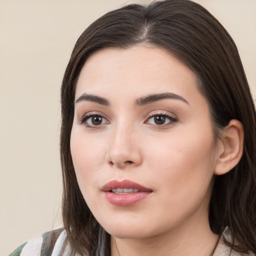 Neutral white young-adult female with long  brown hair and brown eyes