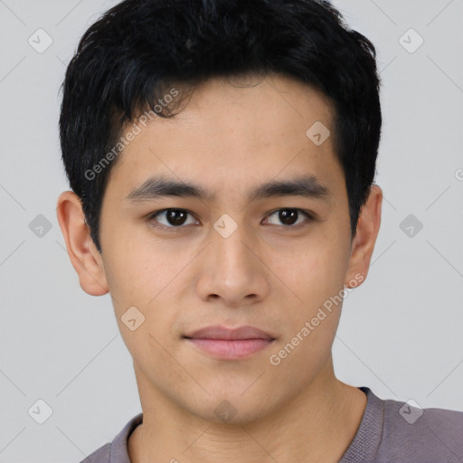 Joyful asian young-adult male with short  black hair and brown eyes