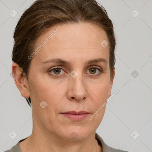 Joyful white adult female with short  brown hair and grey eyes