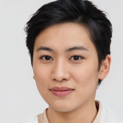Joyful asian young-adult female with short  brown hair and brown eyes