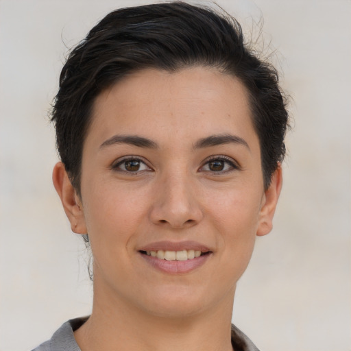 Joyful white young-adult female with short  brown hair and brown eyes