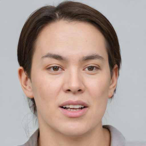 Joyful white young-adult male with medium  brown hair and brown eyes