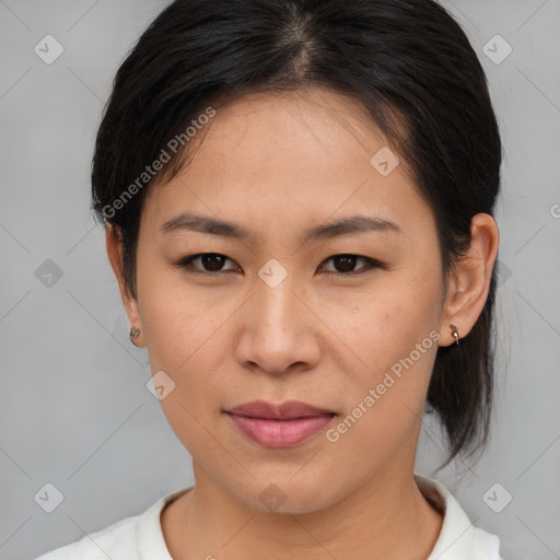 Joyful asian young-adult female with medium  brown hair and brown eyes