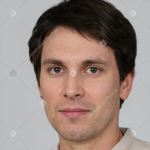 Joyful white adult male with short  brown hair and brown eyes