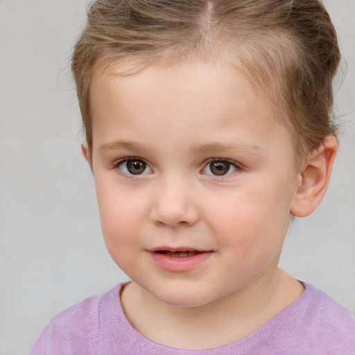 Joyful white child female with short  brown hair and brown eyes